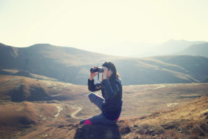 woman-looking-landscape-binoculars